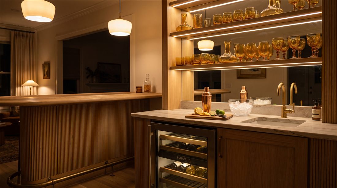 Sub-Zero wine storage in a fluted oak bar